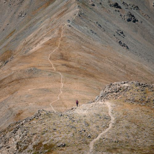 A person standing on top of a mountain